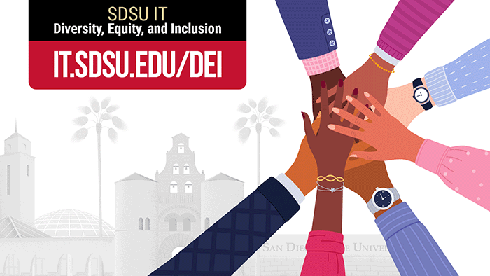 Seven hands representing different ethnicities and cultures, all placed on top of each other in a huddle